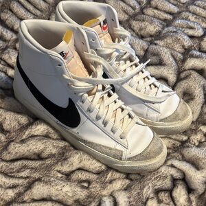 Nike White High-Top Sneakers with Black Swoosh